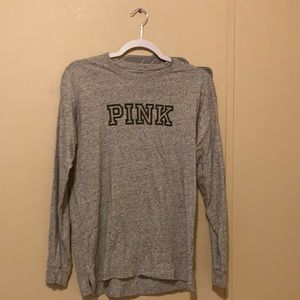 Shirt from pink gray with black words